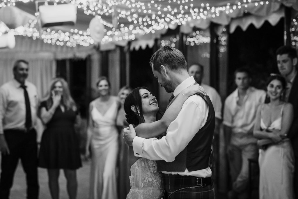 Bride and groom having their first dance on the dance floor.