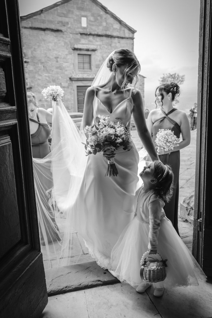 Bride looking at her daughter just before she gets married at Cortona Cathedral in Italy