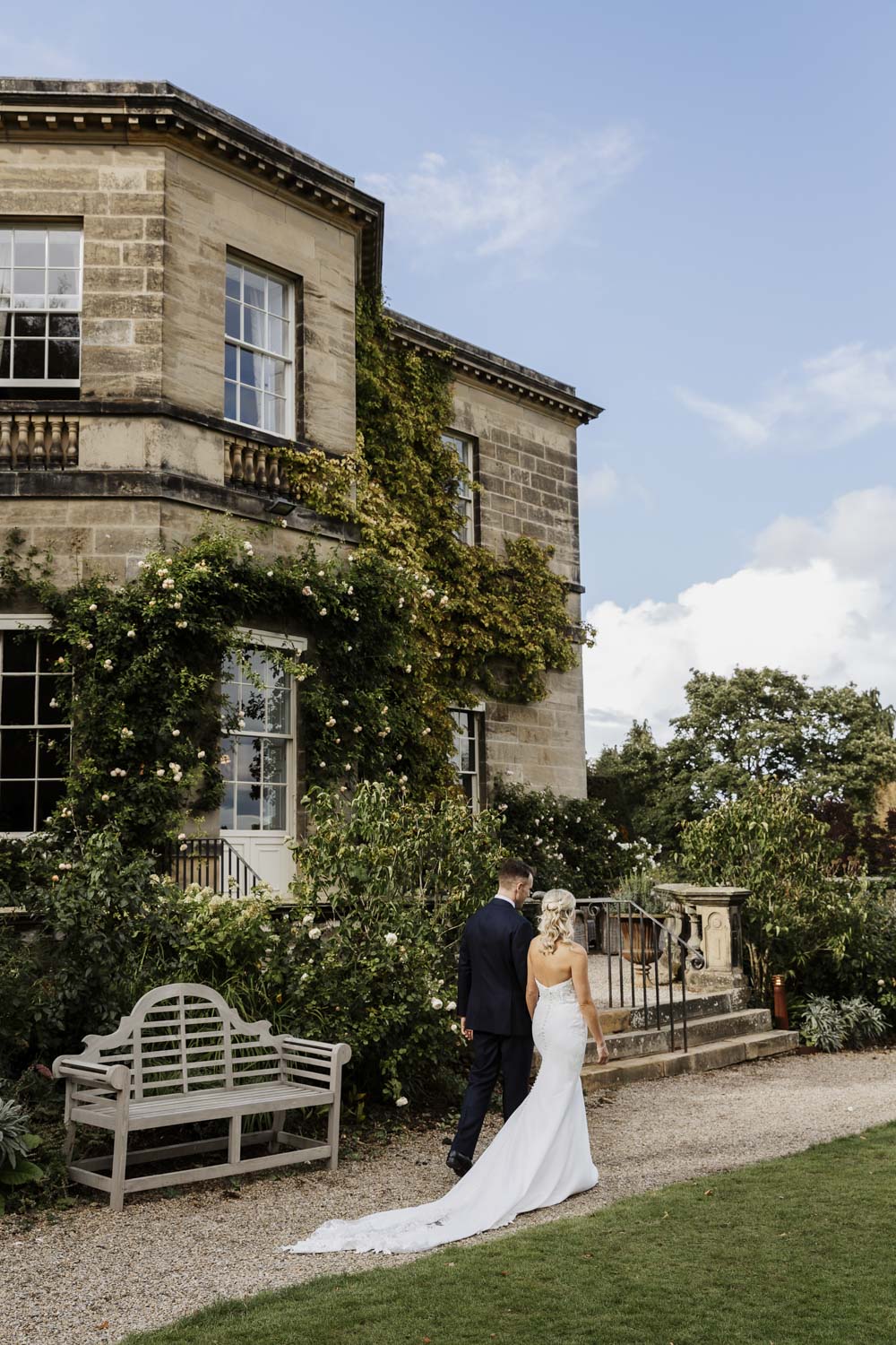 Wedding couple at Middleton Lodge walking in the gardens