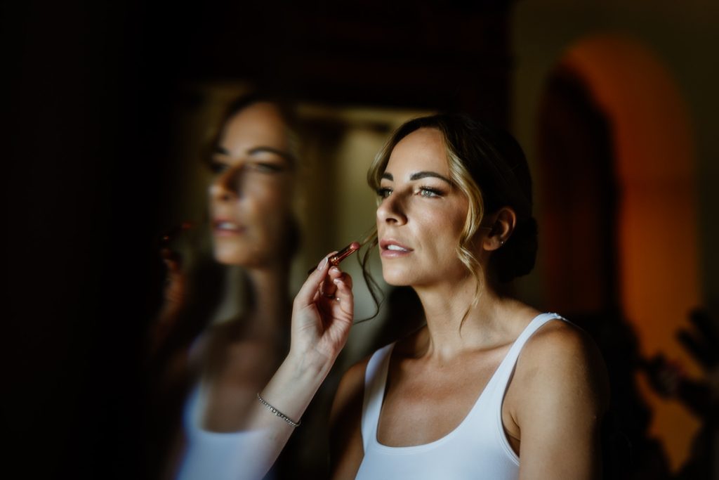 Bride getting her make up done on the morning of her destination wedding at Villa Baroncino