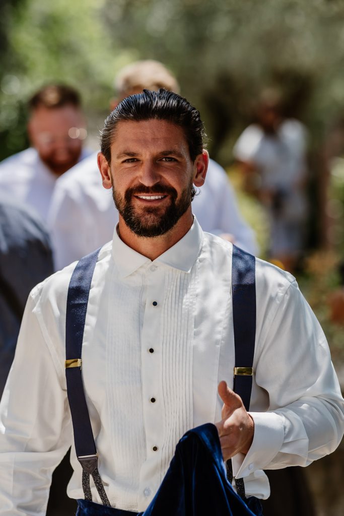 Groom getting ready for his wedding at Villa Baroncino in Italy
