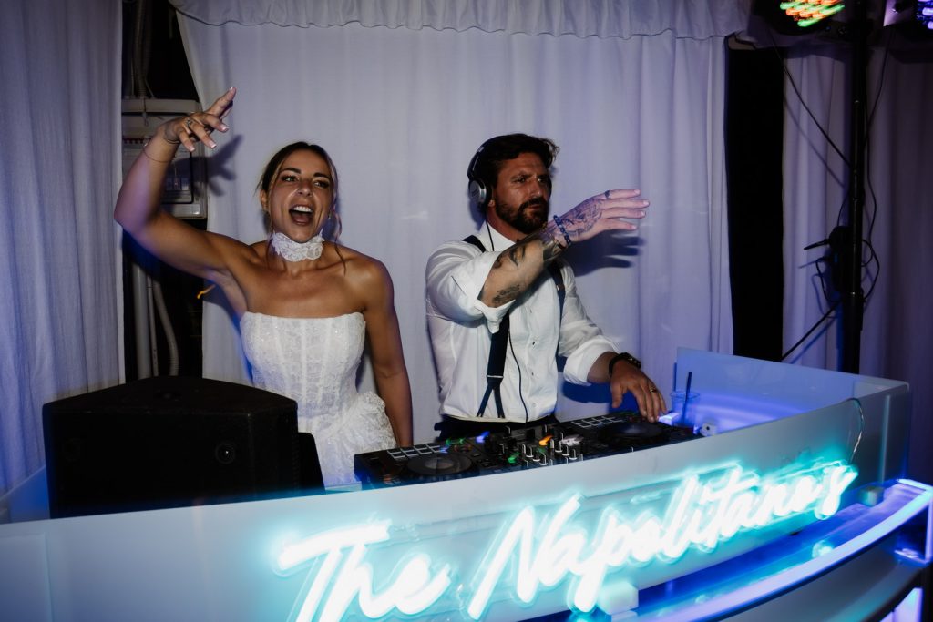 The bride and groom playing a DJ set on their wedding night at Villa Baroncino
